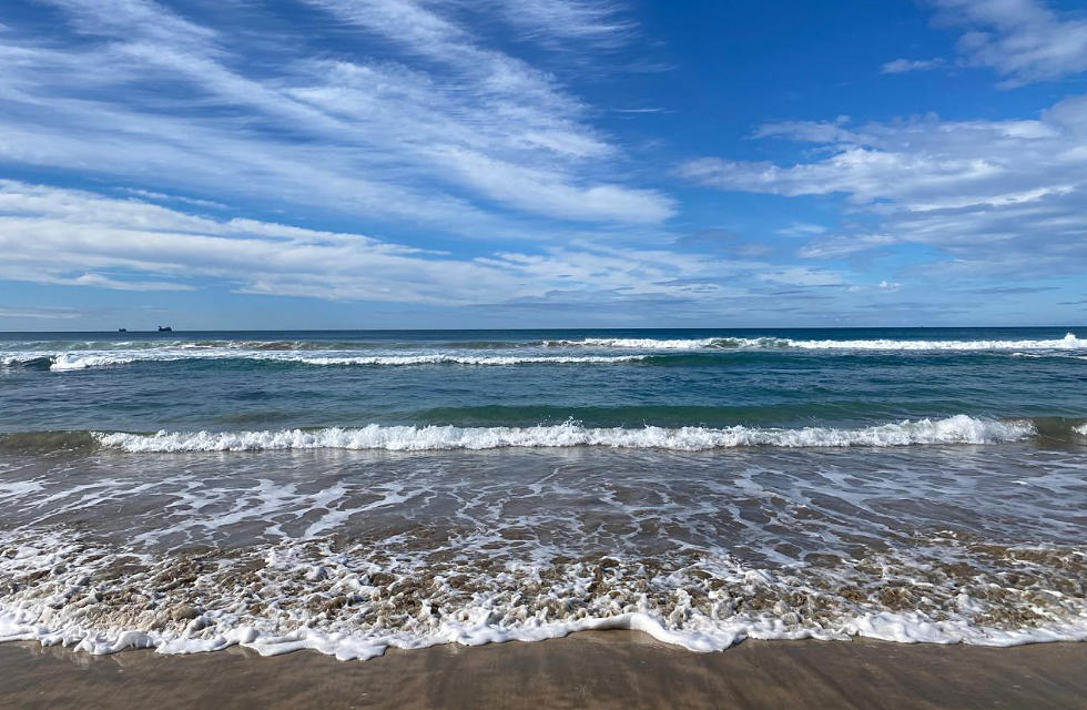 sea wave reaching the beach